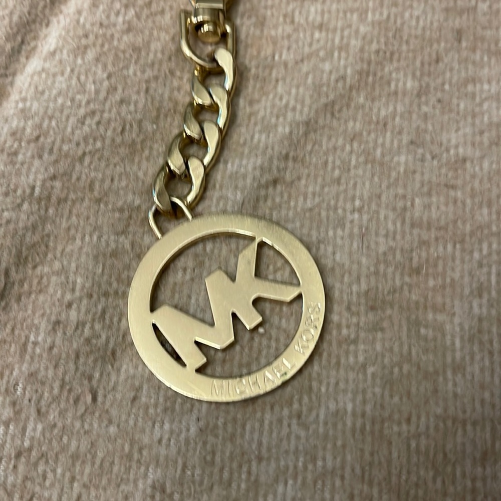 Michael Kors keychain or can be used to put on bag